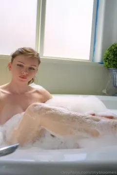 Lily Bloomes is taking a bubble bath at home