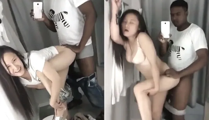 The big slut and the black man were filming themselves having sex in a fitting room at the mall. From the sounds, it seems like there are many people waiting outside.
